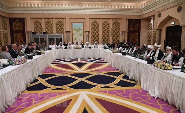 Toàn cảnh vòng đàm phán giữa phái đoàn Mỹ và phái đoàn Taliban tại Doha, Qatar, ngày 26-2.   Ảnh: AFP/TTXVN