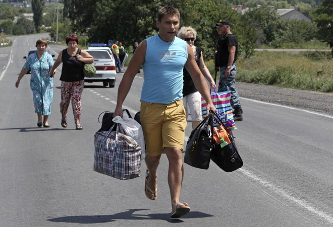 Chiến sự tại Ukraine đã khiến hàng ngàn người chạy sang Nga lánh nạn (Nguồn: Reuters)