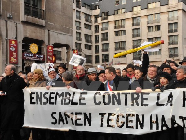 Tuần hành tại Bỉ phản đối vụ tấn công, khủng bố tại Pháp. (Ảnh: Hương Giang/TTXVN)